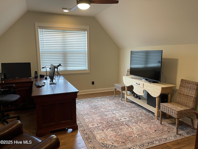 1325 Grandiflora Dr, Leland, NC 28451 - home office featuring vaulted ceiling, visible vents, wood finished floors, and a ceiling fan