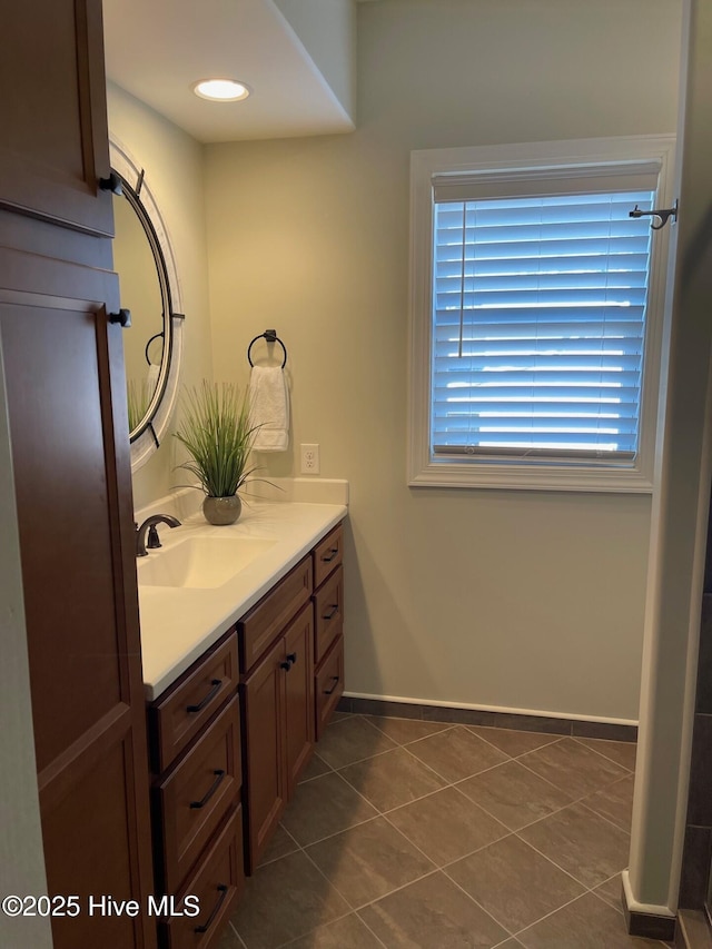 1325 Grandiflora Dr, Leland, NC 28451 - bathroom with baseboards, recessed lighting, tile patterned flooring, and vanity