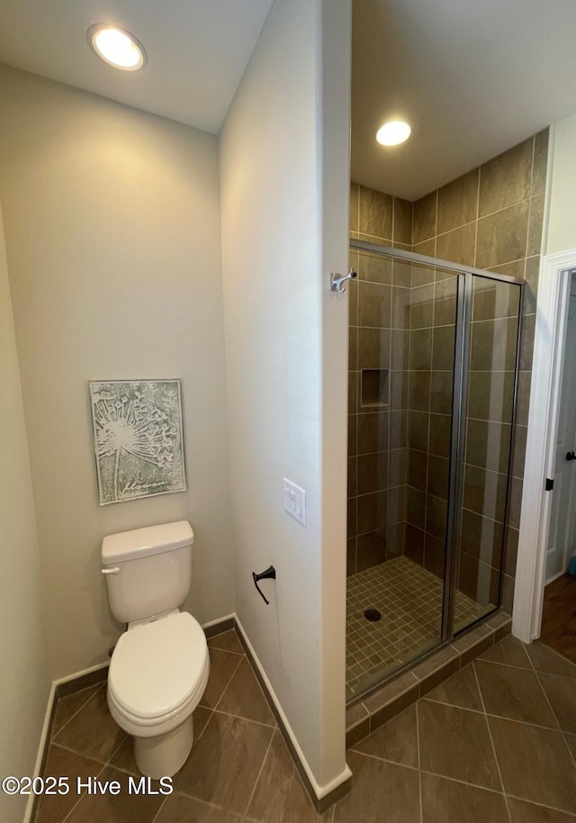 1325 Grandiflora Dr, Leland, NC 28451 - full bath featuring a shower stall, baseboards, toilet, recessed lighting, and tile patterned flooring