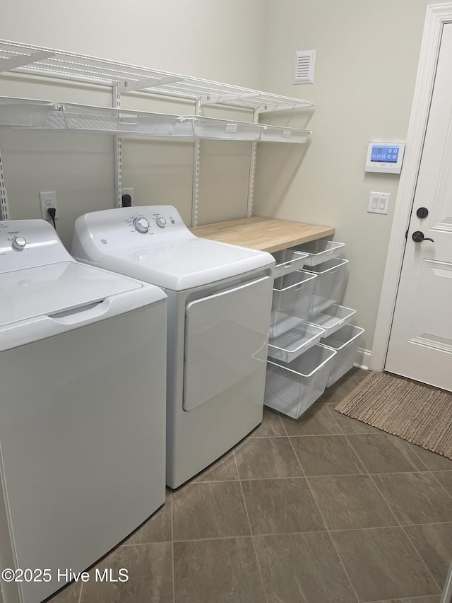 1325 Grandiflora Dr, Leland, NC 28451 - laundry area with washer and clothes dryer, visible vents, and laundry area
