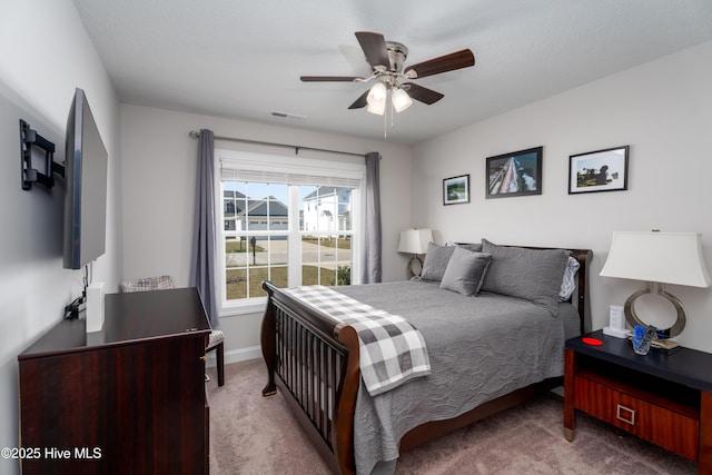 bedroom featuring baseboards, visible vents, ceiling fan, and carpet floors