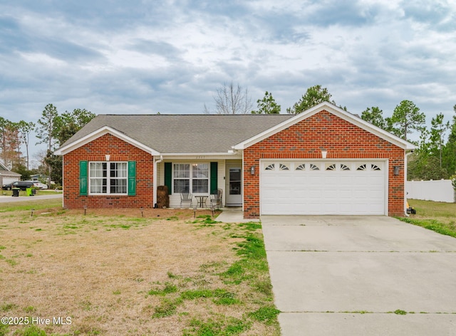 single story home with driveway, a front yard, roof with shingles, brick siding, and a garage