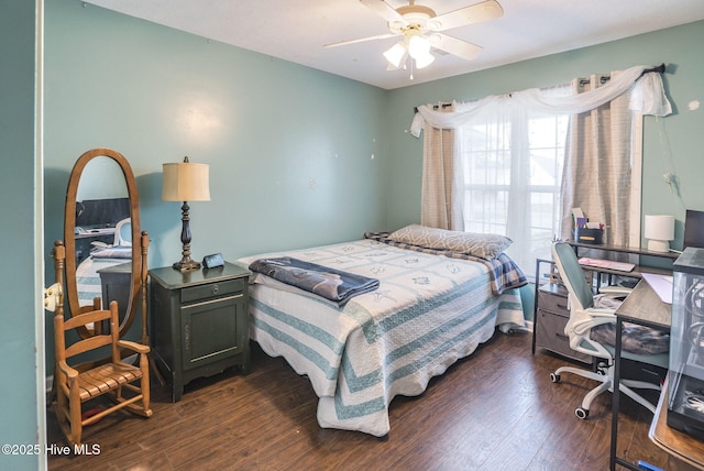 bedroom featuring dark wood-style flooring and a ceiling fan