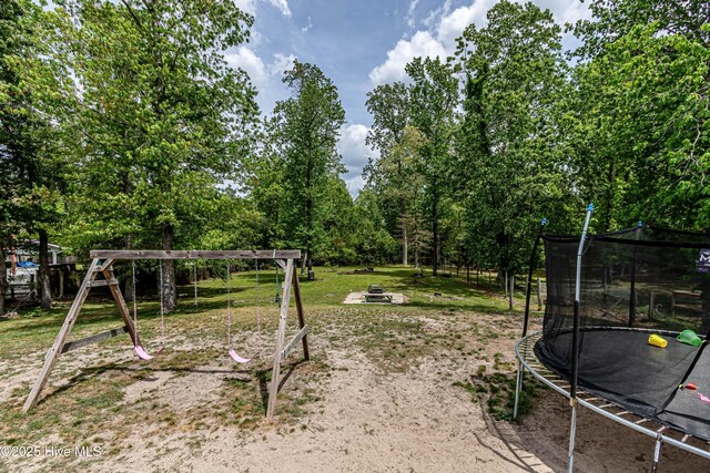 view of yard with a trampoline