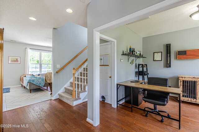 home office featuring recessed lighting, baseboards, and wood finished floors