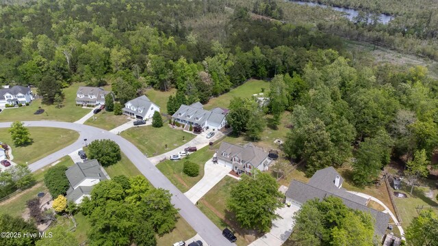 bird's eye view featuring a residential view and a view of trees
