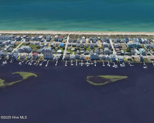 bird's eye view featuring a residential view and a water view