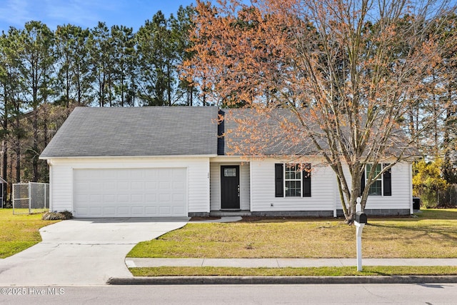 ranch-style house featuring concrete driveway, a garage, fence, and a front lawn