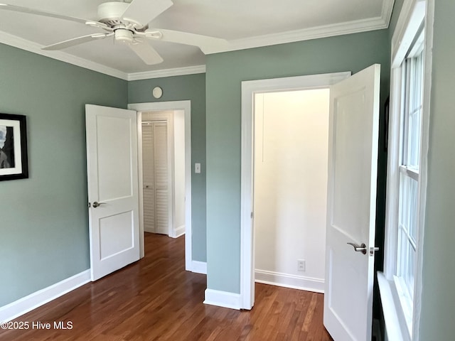 102 N 25th St, Wilmington, NC 28405 - unfurnished bedroom with baseboards, ornamental molding, and dark wood-type flooring
