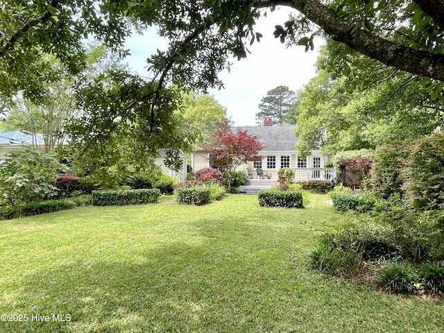102 N 25th St, Wilmington, NC 28405 - view of grassy yard with a deck