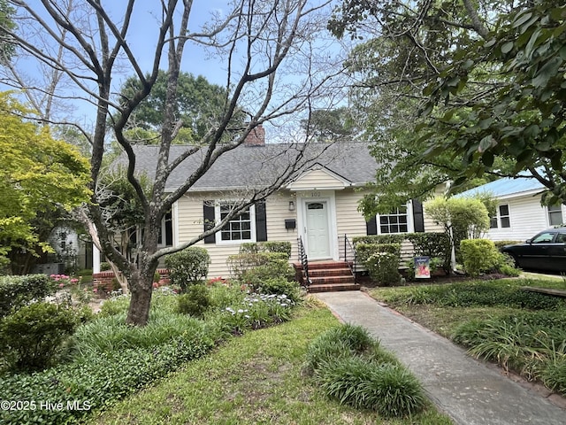 102 N 25th St, Wilmington, NC 28405 - view of front facade with a chimney and a shingled roof