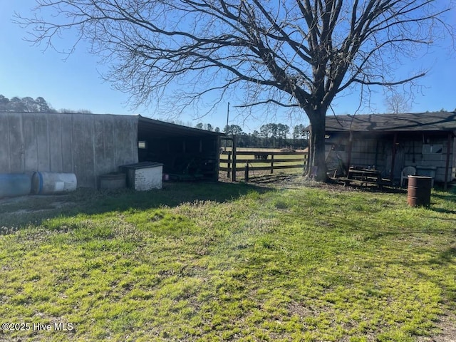 5635 Mckendree Church Rd, Tarboro, NC 27886 - view of yard with an outdoor structure, fence, and a pole building