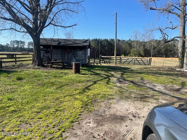 5635 Mckendree Church Rd, Tarboro, NC 27886 - view of yard with a rural view, an outbuilding, and fence