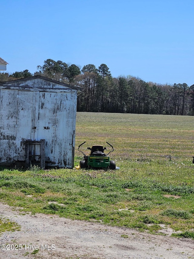 5635 Mckendree Church Rd, Tarboro, NC 27886 - view of yard with a shed, a forest view, and an outdoor structure