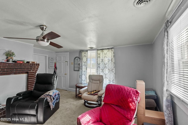 5635 Mckendree Church Rd, Tarboro, NC 27886 - living room with a fireplace, carpet, a ceiling fan, visible vents, and a healthy amount of sunlight