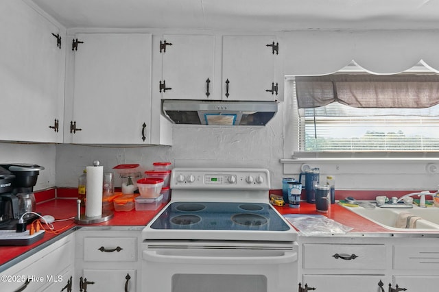 5635 Mckendree Church Rd, Tarboro, NC 27886 - kitchen featuring white cabinets, extractor fan, light countertops, and white range with electric cooktop