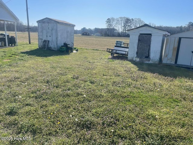 5635 Mckendree Church Rd, Tarboro, NC 27886 - view of yard with a rural view, a storage unit, and an outdoor structure