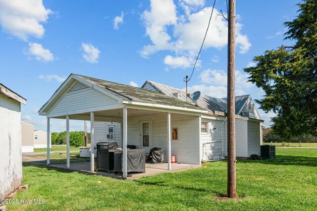 5635 Mckendree Church Rd, Tarboro, NC 27886 - back of house featuring a yard, a patio area, and central AC