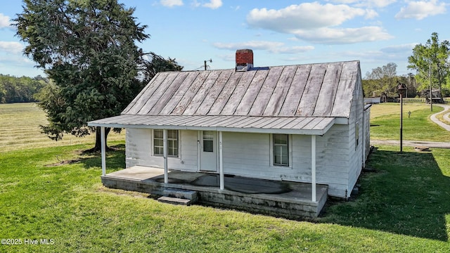 5635 Mckendree Church Rd, Tarboro, NC 27886 - exterior space featuring a chimney, a standing seam roof, metal roof, and a lawn