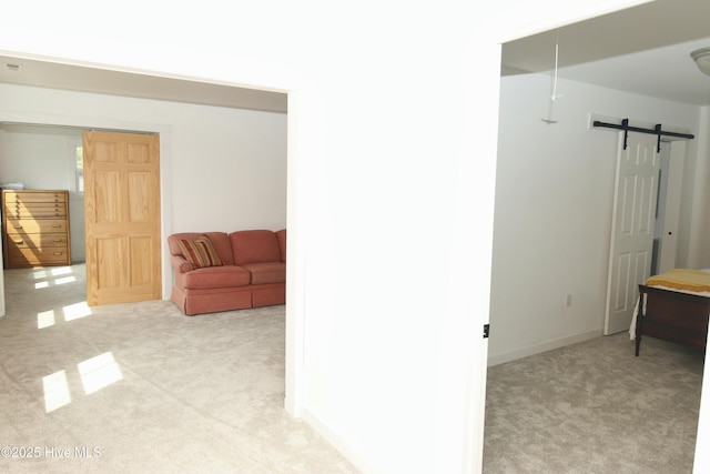 interior space featuring carpet flooring and a barn door