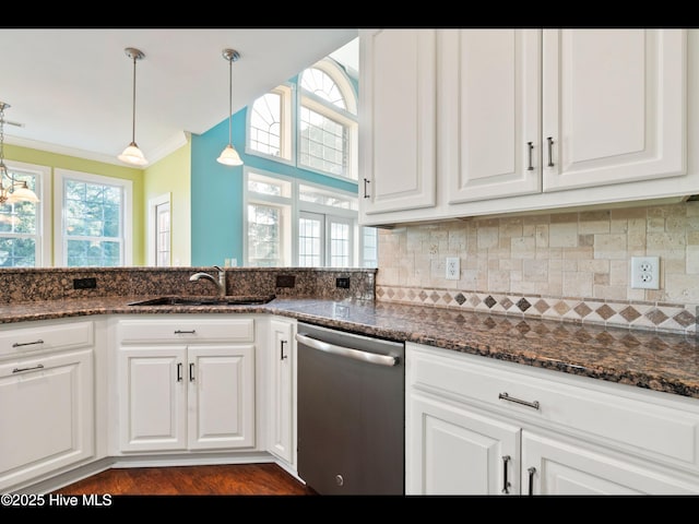 4404 Gauntlet Dr SE, Southport, NC 28461 - kitchen featuring stainless steel dishwasher, a sink, ornamental molding, white cabinetry, and tasteful backsplash