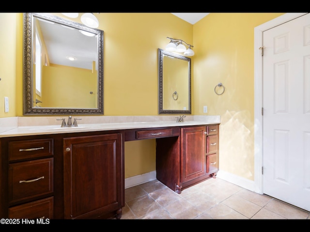 4404 Gauntlet Dr SE, Southport, NC 28461 - bathroom with double vanity, baseboards, and tile patterned flooring