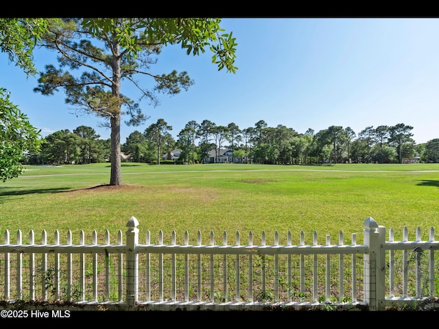 4404 Gauntlet Dr SE, Southport, NC 28461 - view of yard with view of golf course and view of wooded area