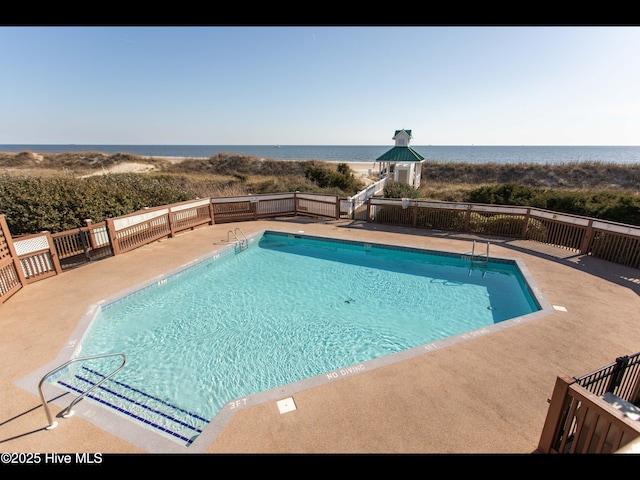 4404 Gauntlet Dr SE, Southport, NC 28461 - community pool with a water view and a patio