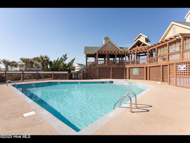 4404 Gauntlet Dr SE, Southport, NC 28461 - community pool featuring stairway and a deck