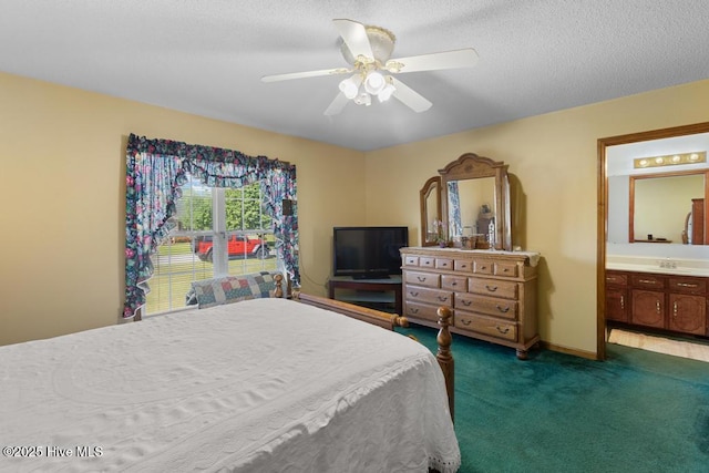 201 Cantle Ct, Jacksonville, NC 28540 - carpeted bedroom featuring a textured ceiling, ensuite bath, a ceiling fan, and a sink