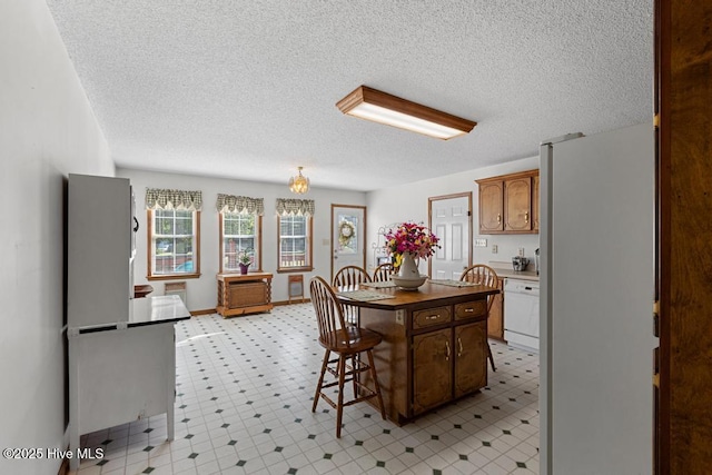 201 Cantle Ct, Jacksonville, NC 28540 - dining area featuring light floors and a textured ceiling