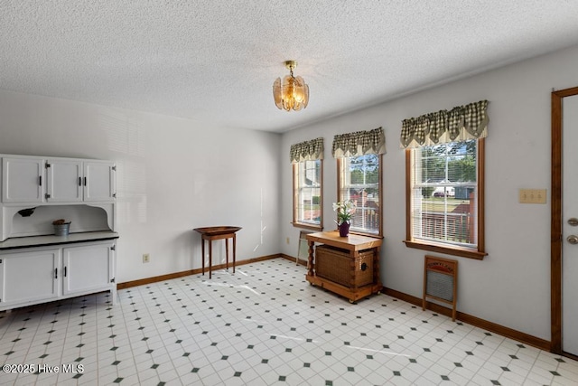 201 Cantle Ct, Jacksonville, NC 28540 - dining area featuring light floors, baseboards, and a textured ceiling