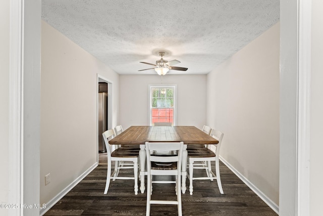 dining space with baseboards, a ceiling fan, wood finished floors, and a textured ceiling