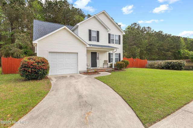 traditional-style home featuring roof with shingles, a front lawn, driveway, fence, and an attached garage
