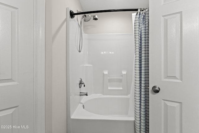 bathroom featuring shower / bath combo with shower curtain