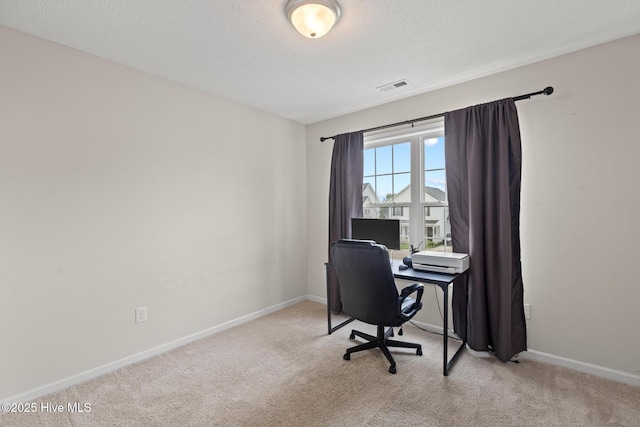 office with baseboards, visible vents, and carpet