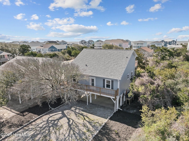 birds eye view of property with a residential view