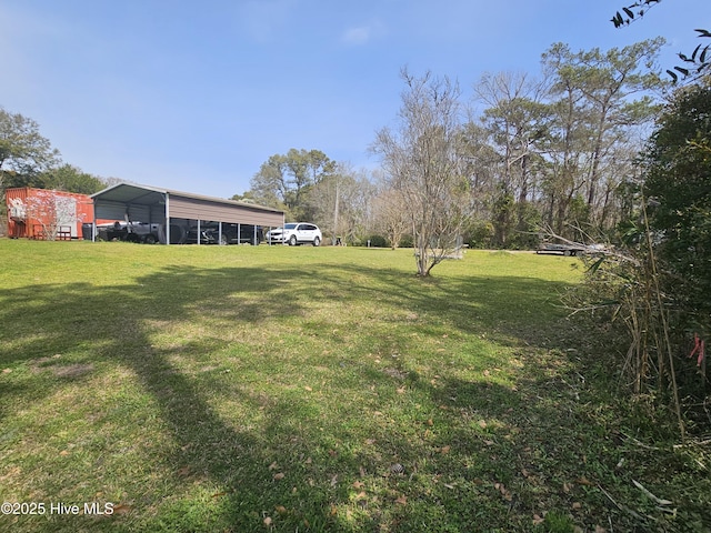 1229 Fletcher Hewett Rd SW, Shallotte, NC 28470 - view of green lawn featuring a detached carport