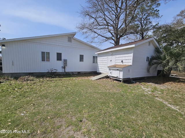 1229 Fletcher Hewett Rd SW, Shallotte, NC 28470 - back of house featuring crawl space and a lawn