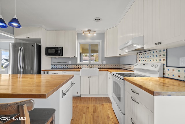 kitchen with white cabinetry, white appliances, butcher block countertops, under cabinet range hood, and a sink