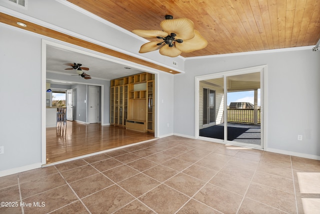 unfurnished room with baseboards, ceiling fan, ornamental molding, tile patterned floors, and wooden ceiling
