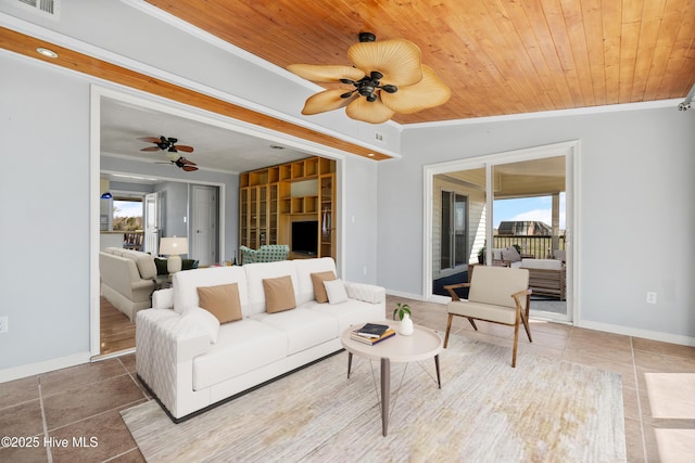 living area with a ceiling fan, wood ceiling, crown molding, and tile patterned flooring