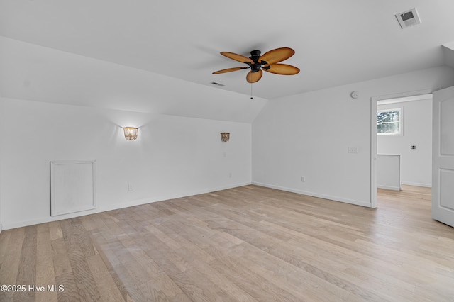 bonus room featuring light wood-style floors, visible vents, and a ceiling fan