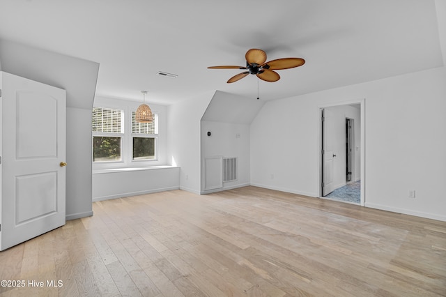 unfurnished living room with baseboards, ceiling fan, light wood-type flooring, and visible vents