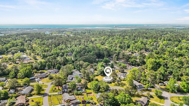 aerial view featuring a forest view and a residential view