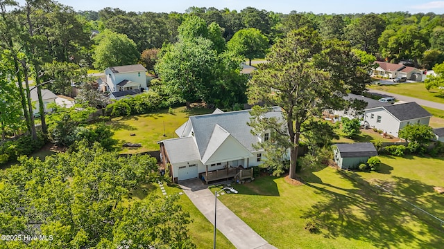 birds eye view of property with a residential view