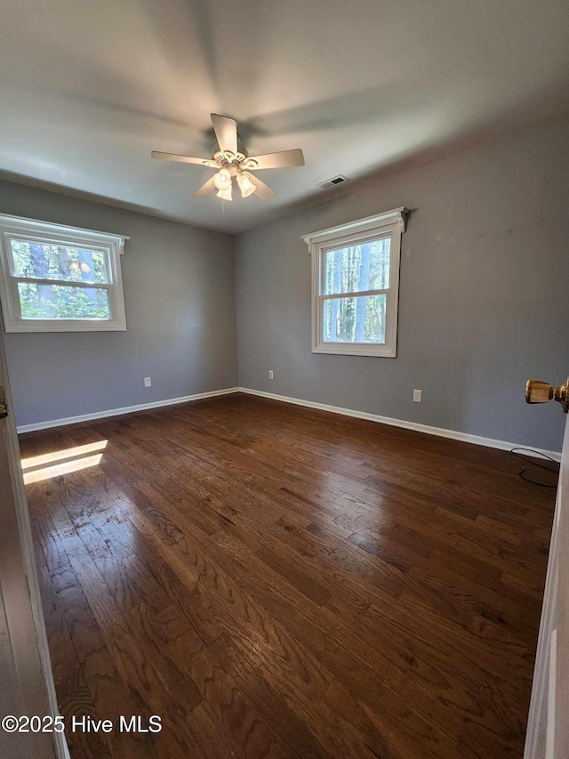 106 Hunters Trl E, Elizabeth City, NC 27909 - empty room featuring baseboards, dark wood-style flooring, and a ceiling fan