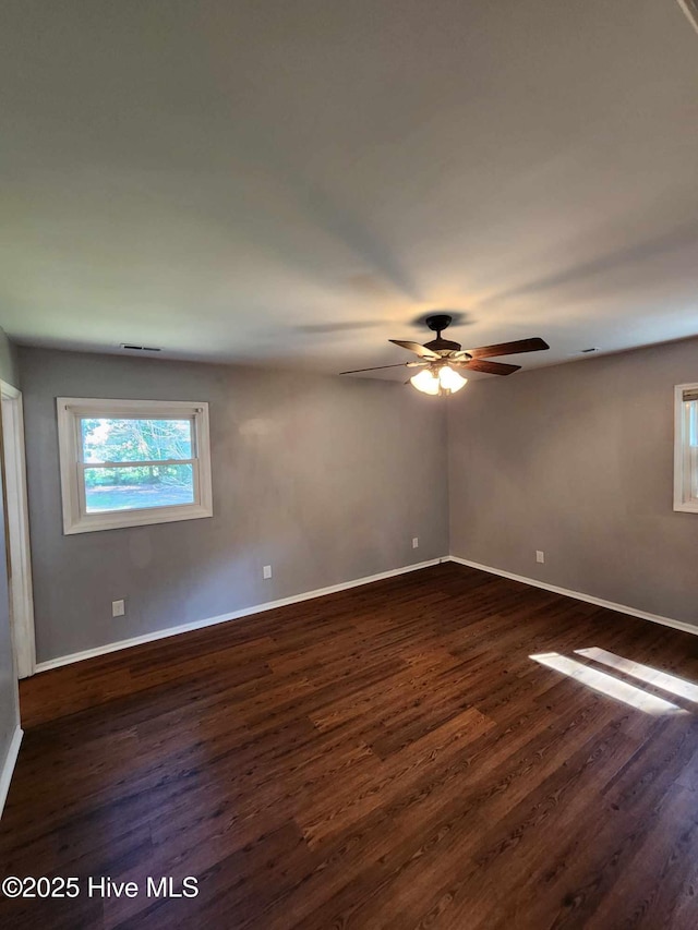 106 Hunters Trl E, Elizabeth City, NC 27909 - unfurnished room with dark wood-style flooring, visible vents, baseboards, and ceiling fan