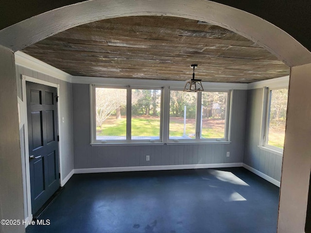 106 Hunters Trl E, Elizabeth City, NC 27909 - empty room with finished concrete flooring, a wealth of natural light, and wood ceiling