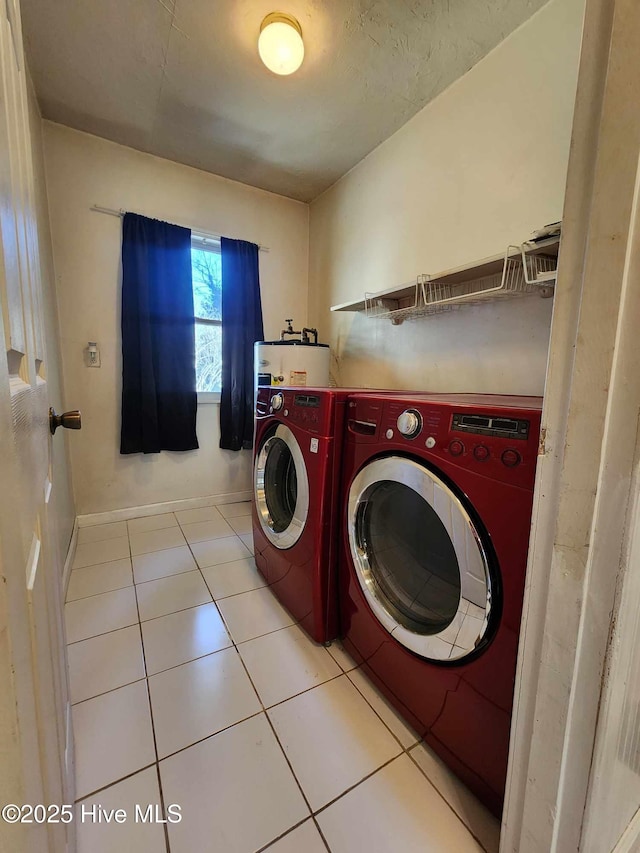 106 Hunters Trl E, Elizabeth City, NC 27909 - laundry area with baseboards, laundry area, tile patterned floors, water heater, and washing machine and dryer